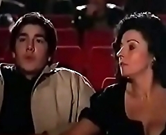 Milf jerks off young guy at the theater